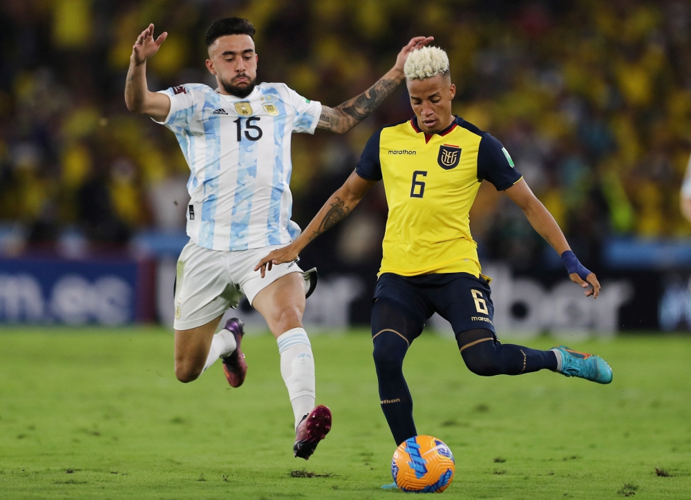 Ecuador's Byron Castillo in action with Argentina's Nicolas Gonzalez during the World Cup South American Qualifiers on  March 29, 2022. (REUTERS/Jose Jacome)