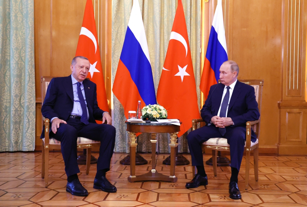 Russian President Vladimir Putin listens to Turkish President Tayyip Erdogan during a meeting in Sochi, Russia, on August 5, 2022. (Sputnik/Vyacheslav Prokofyev/Pool via REUTERS)