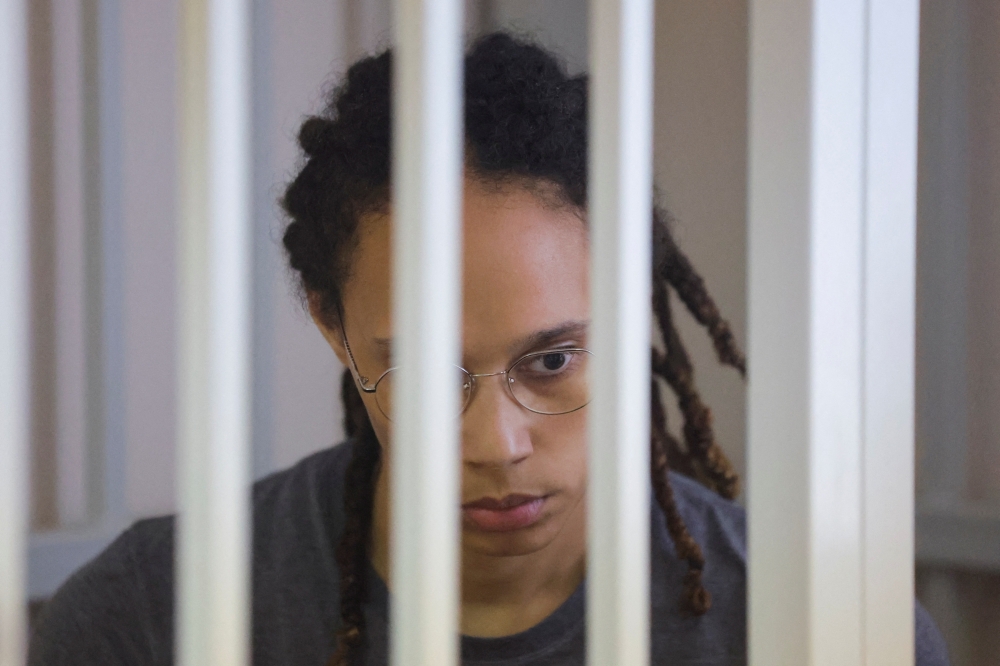 US basketball player Brittney Griner sits inside a defendants' cage during the reading of the court's verdict in Khimki outside Moscow, Russia, August 4, 2022. (REUTERS/Evgenia Novozhenina/Pool)
