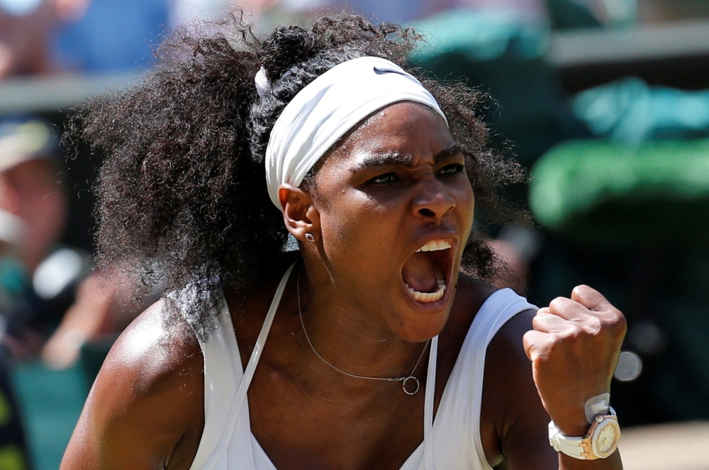 File Photo: Serena Williams reacts after winning the first set of Women's Final match against Garbine Muguruza of Spain at the Wimbledon Tennis Championships in London, July 11, 2015. (REUTERS/Suzanne Plunkett)
