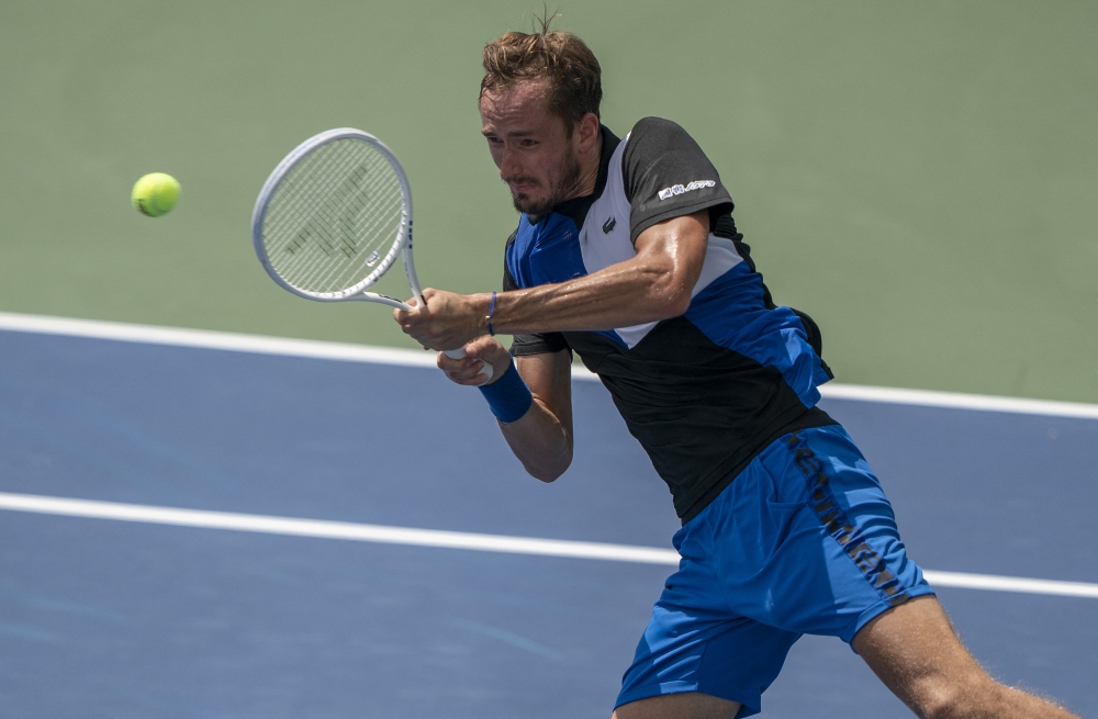 Daniil Medvedev (RUS) returns a shot during his match against Denis Shapovalov (CAN) at the Western & Southern Open at the at the Lindner Family Tennis Center. Mandatory Credit: Susan Mullane-USA TODAY Sports
