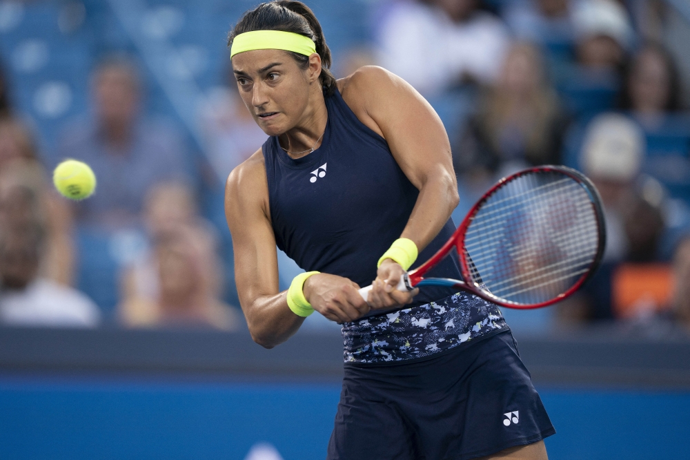 Caroline Garcia (FRA) returns a shot during her match against Jessica Pegula (USA) at the Western & Southern Open at the Lindner Family Tennis Center. Susan Mullane-USA Today Sports
 
