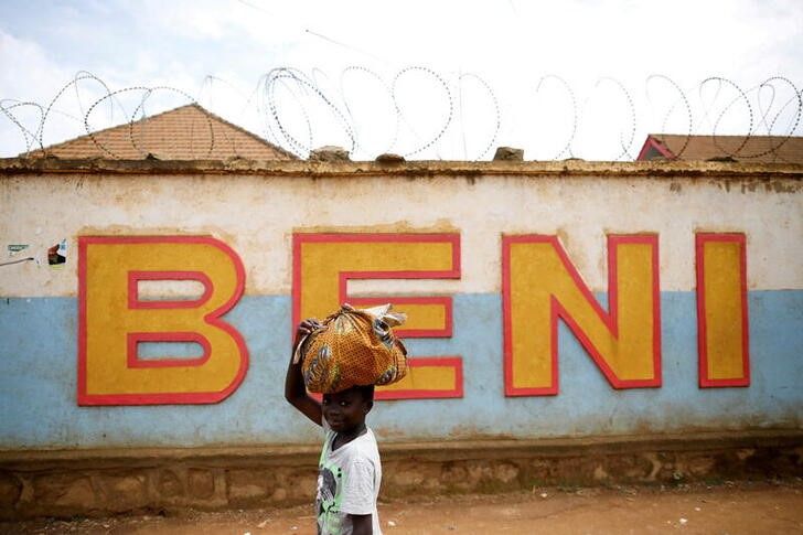A Congolese boy walks past a wall in Beni, in the Democratic Republic of Congo, April 1, 2019. REUTERS/Baz Ratner/File Photo


