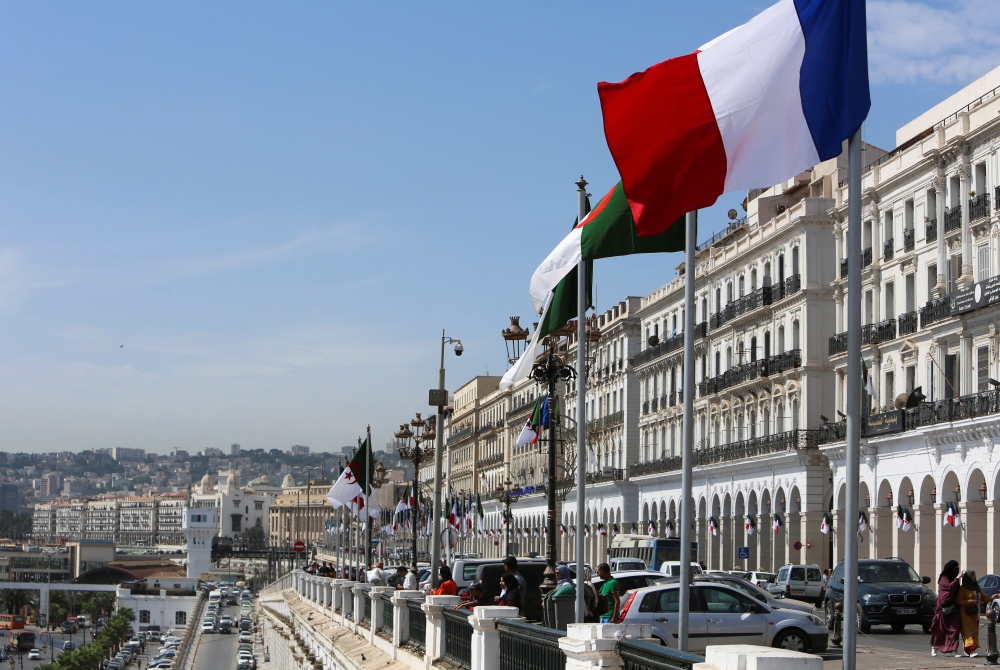 Algerian and French flags flutter ahead of the arrival of French President Emmanuel Macron, in Algiers, Algeria, on August 25, 2022. REUTERS/Ramzi Boudina