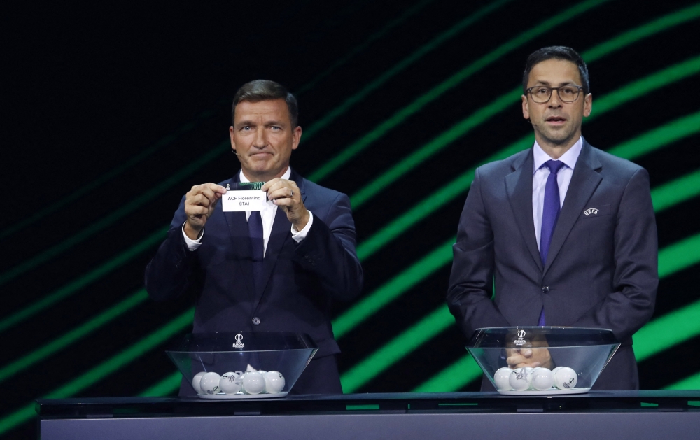 Vladimir Smicer draws Fiorentina as UEFA Head of Club Competitions & Calendar Tobias Hedtstuck looks on Reuters/Murad Sezer