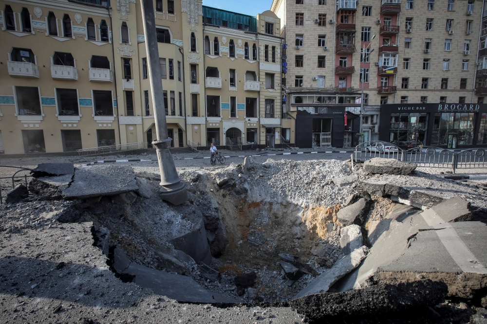A crater left by a night Russian military strike is seen, as Russia's attack on Ukraine continues, in central Kharkiv, Ukraine August 27, 2022. REUTERS/Vyacheslav Madiyevskyy
