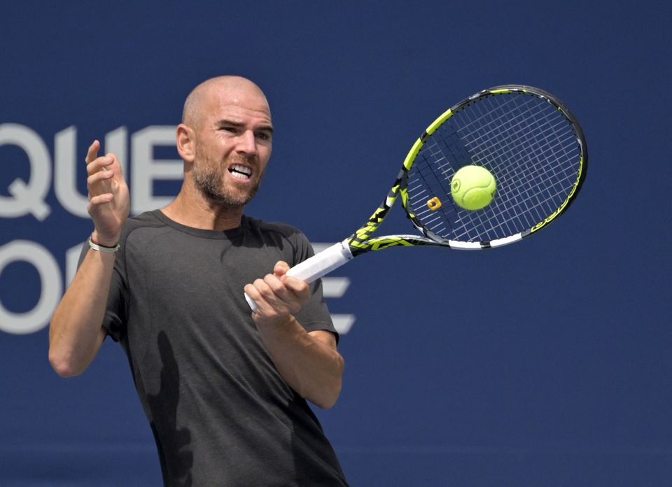 Adrian Mannarino (FRA) hits a forehand against Jannik Sinner (ITA) (not pictured) in second round play at IGA Stadium. Mandatory Credit: Eric Bolte-USA TODAY Sports

