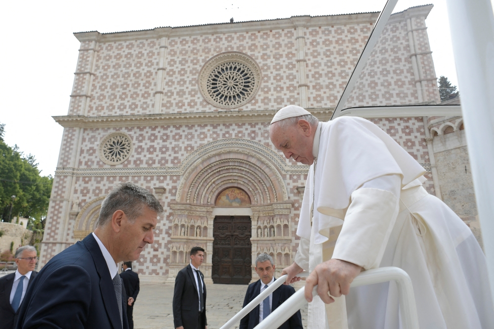Pope Francis visits the Basilica of Santa Maria di Collemaggio in L'Aquila, Italy, on August 28, 2022. Vatican Media/­Handout via REUTERS 