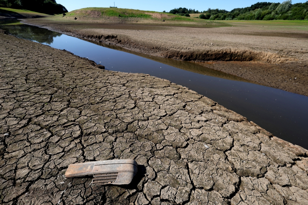 Cracks can be seen in the dried up bed of Tittesworth Reservoir, in Leek, Britain, on August 12, 2022. REUTERS/Carl Recine/File Photo