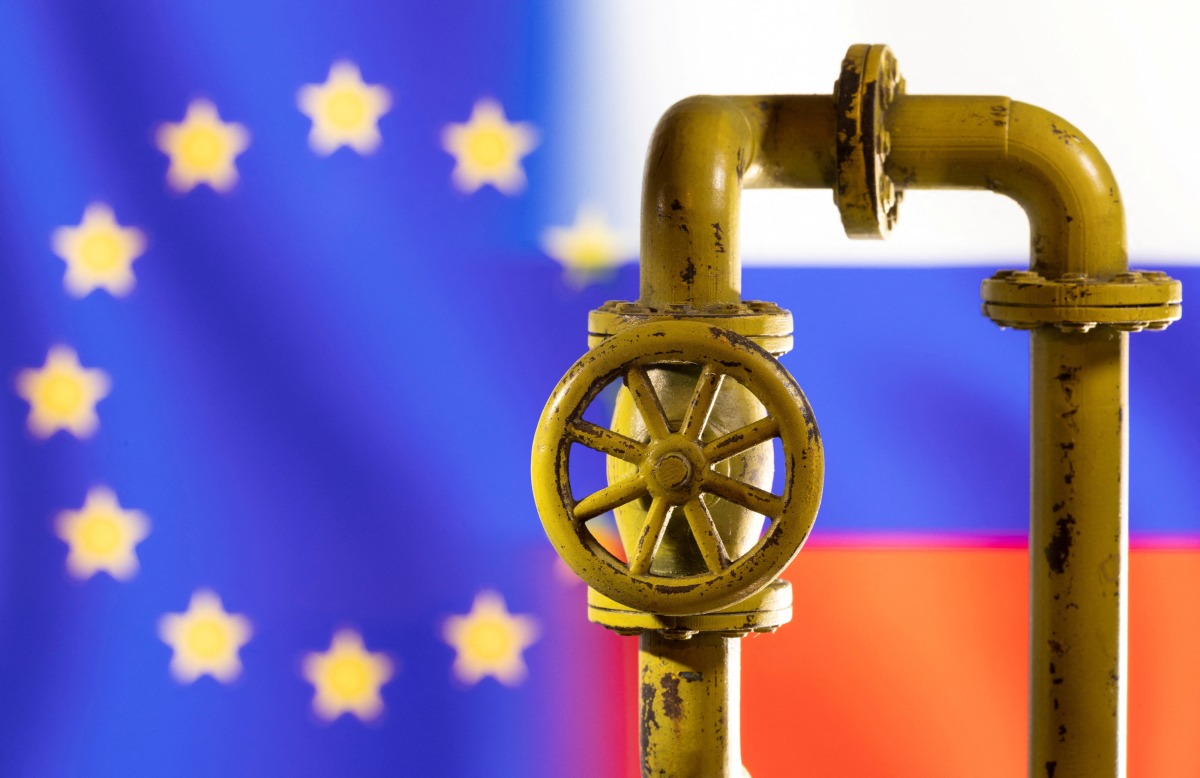 A model of the natural gas pipeline is seen in front of displayed word EU and Russia flag colours in this illustration taken on March 8, 2022. REUTERS/Dado Ruvic/Illustration