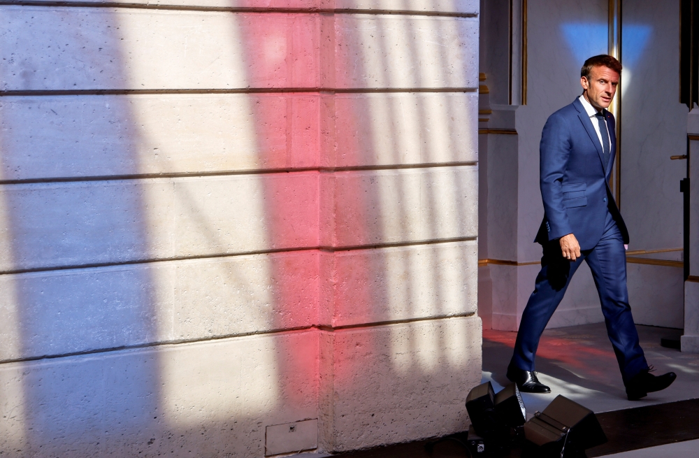 France's President Emmanuel Macron arrives to address the media following a conference with Germany's Chancellor Olaf Scholz on the energy crisis via video link, at the Elysee Palace in Paris, on September 5, 2022.  Ludovic Marin/Pool via REUTERS
