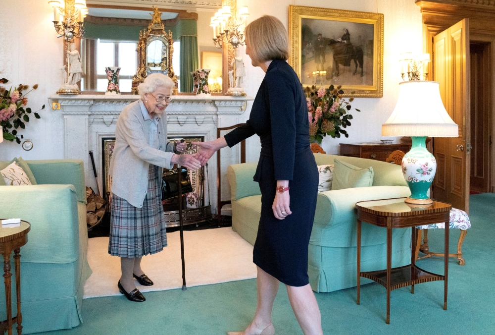 Queen Elizabeth welcomes Liz Truss during an audience where she invited the newly elected leader of the Conservative party to become Prime Minister and form a new government, at Balmoral Castle, Scotland, on September 6, 2022. Jane Barlow/Pool via REUTERS