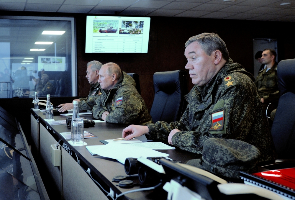 Russian President Vladimir Putin (centre), Defence Minister Sergei Shoigu (left) and Chief of the General Staff of Russian Armed Forces Valery Gerasimov oversee the Vostok-2022 (East-2022) military drills at Sergeyevsky training ground in the far eastern Primorsky Region, Russia, on September 6, 2022.  Sputnik/Mikhail Klimentyev/Pool via REUTERS