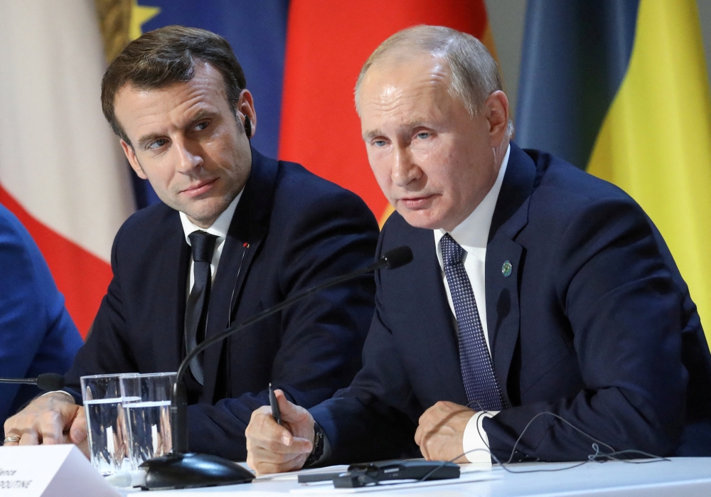French President Emmanuel Macron and Russian President Vladimir Putin give a press conference after a summit on Ukraine at the Elysee Palace in Paris, on December 9, 2019. File Photo / Reuters