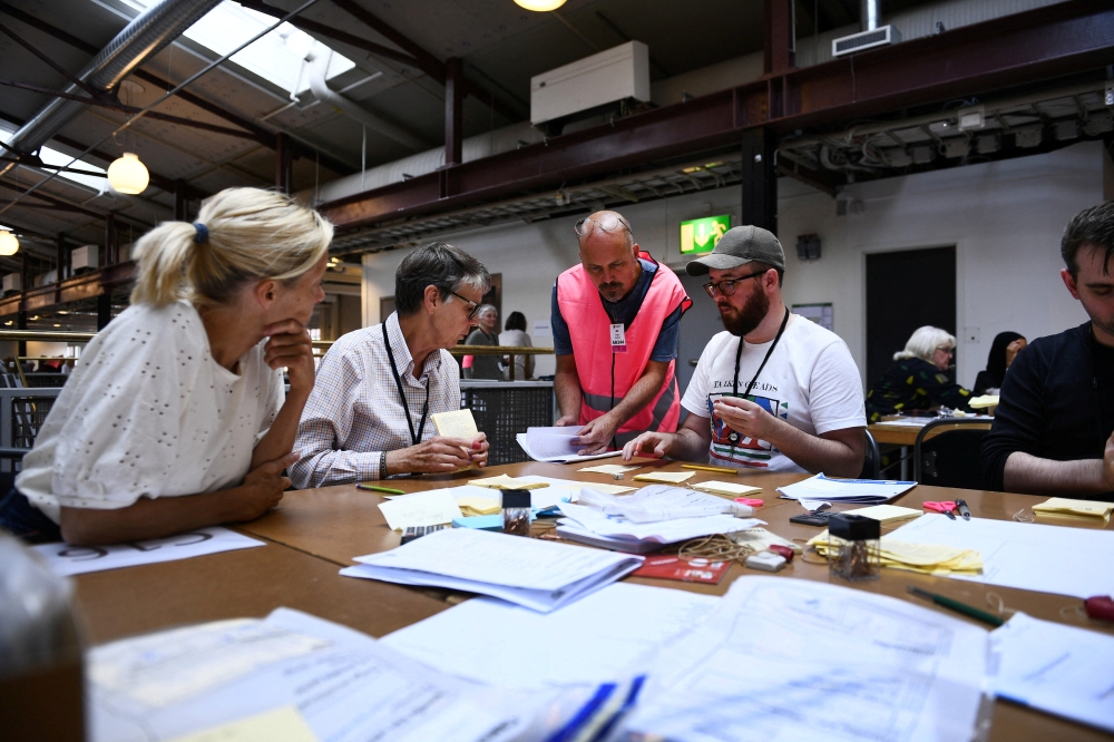 he County Administrative Board in Stockholm County begins the final vote count at Nacka Expo Center after Sunday's election, in Stockholm on September 12, 2022. TT News Agency/Tim Aro via REUTERS 