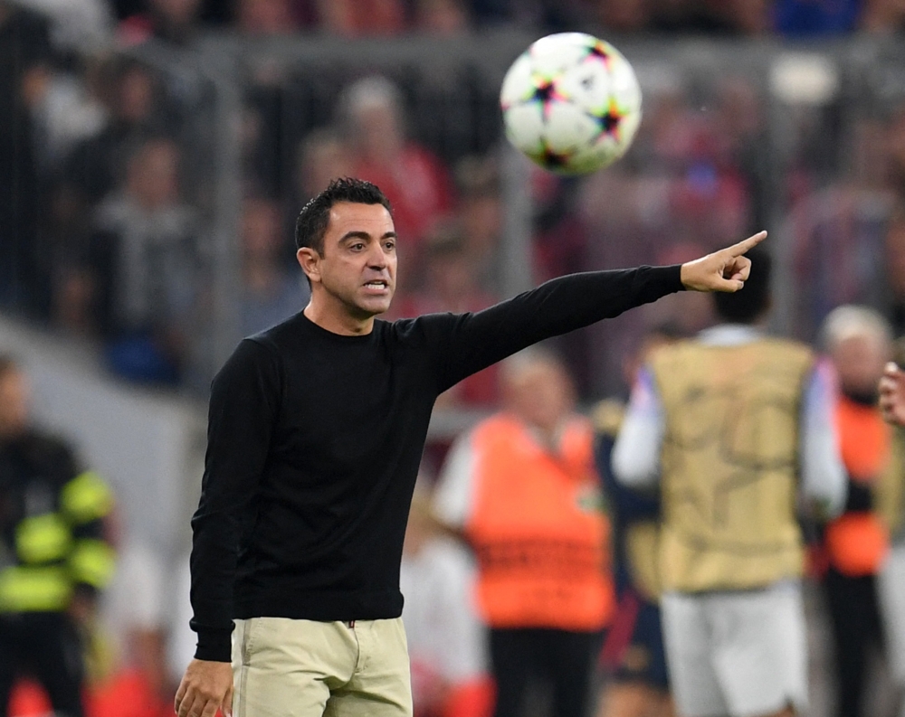 FC Barcelona coach Xavi reacts REUTERS/Andreas Gebert

