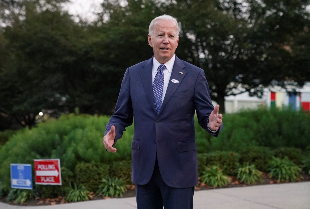 US President Joe Biden speaks outside a polling station after voting in the Delaware primary, in Wilmington, Delaware, on September 13, 2022. REUTERS/Kevin Lamarque