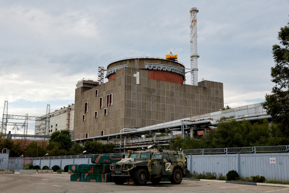 A Russian all-terrain armoured vehicle is parked outside the Zaporizhzhia Nuclear Power Plant during the visit of the International Atomic Energy Agency (IAEA) expert mission in the course of Ukraine-Russia conflict outside Enerhodar in the Zaporizhzhia region, Ukraine, on September 1, 2022. REUTERS/Alexander Ermochenko