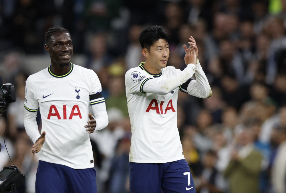 Tottenham Hotspur's Son Heung-min and Yves Bissouma (left) celebrate after their EPL match against Leicester City at the Tottenham Hotspur Stadium in London on September 17, 2022.  Action Images via Reuters/Peter Cziborra 