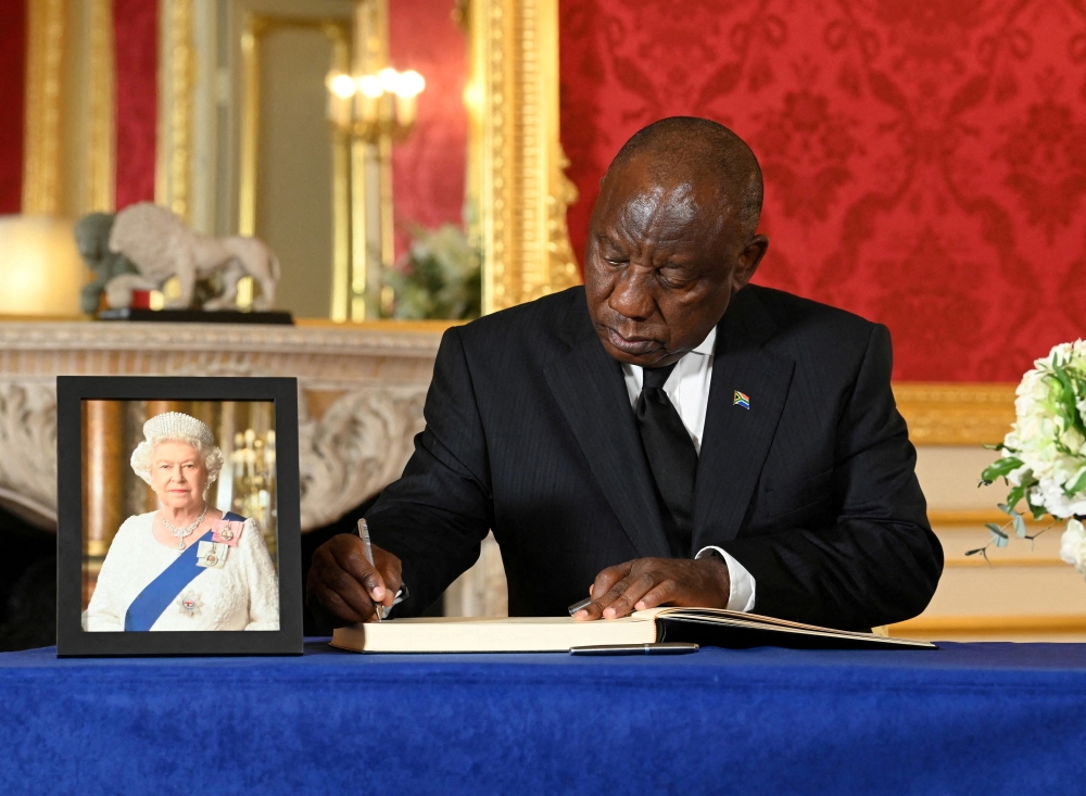 South African President Cyril Ramaphosa signs a book of condolence at Lancaster House in London, following the death of Queen Elizabeth II. Picture date: Sunday September 18, 2022. Jonathan Hordle/Pool via REUTERS/File Photo