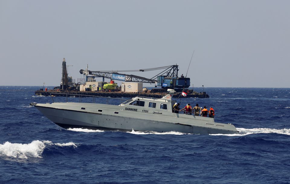 A Lebanese navy ship takes the family members of migrants missing since a boat sunk in April, on a tour of an area where a submarine was being prepared to search for the wreck of the boat off the Lebanese coast of Tripoli, Lebanon August 22, 2022.  File Photo / Reuters
