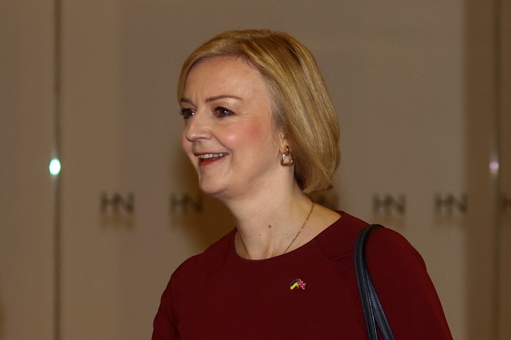 British Prime Minister Liz Truss leaves a television studio after appearing on 