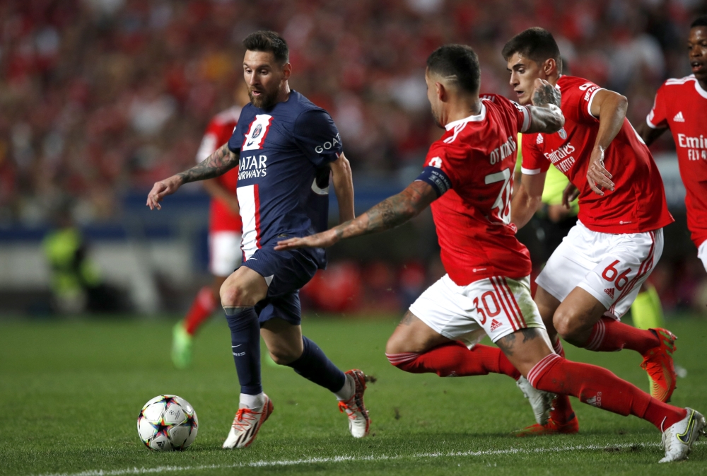 Paris St Germain's Lionel Messi in action against Benfica players during their Champions League Group H match at the Estadio da Luz, Lisbon, Portugal, on October 5, 2022. 
REUTERS/Pedro Nunes