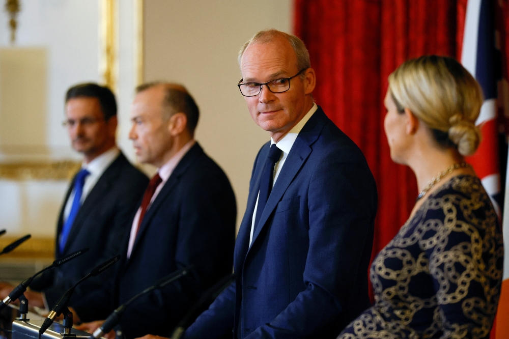 Ireland's Foreign Minister Simon Coveney, Ireland's Minister for Justice Helen McEntee, Minister of State for Northern Ireland Steve Baker and Secretary of State for Northern Ireland Chris Heaton-Harris hold a news conference, during the British-Irish Intergovernmental Conference in London, Britain, on October 7, 2022. REUTERS/Peter Nicholls