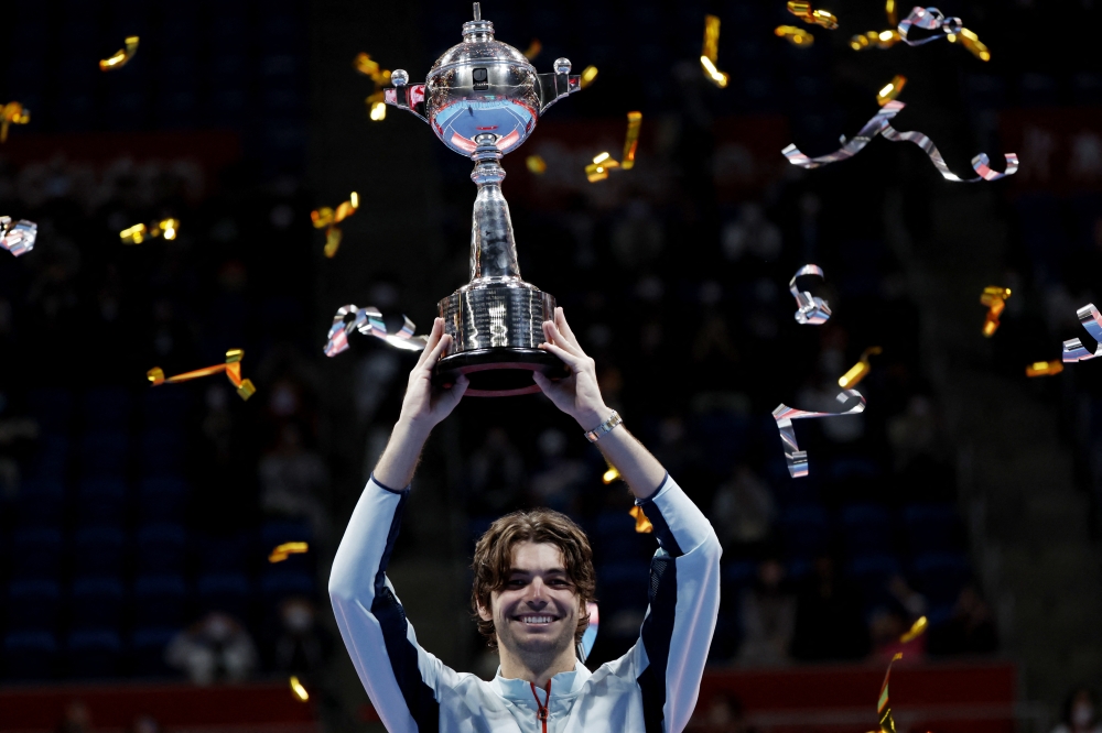 Taylor Fritz of the U.S. celebrates with the trophy after winning the men's singles final against Frances Tiafoe of the U.S. REUTERS/Androniki Christodoulou
