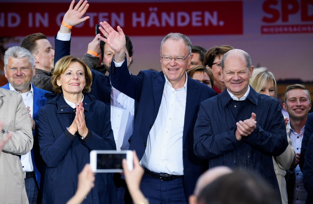 German Chancellor Olaf Scholz, Minister President of Lower Saxony Stephan Weil and Minister President of Rhineland-Palatinate Malu Dreyer attend the final rally ahead of the regional elections in the state of Lower Saxony, in Hanover, Germany, on October 8, 2022. REUTERS/Fabian Bimmer