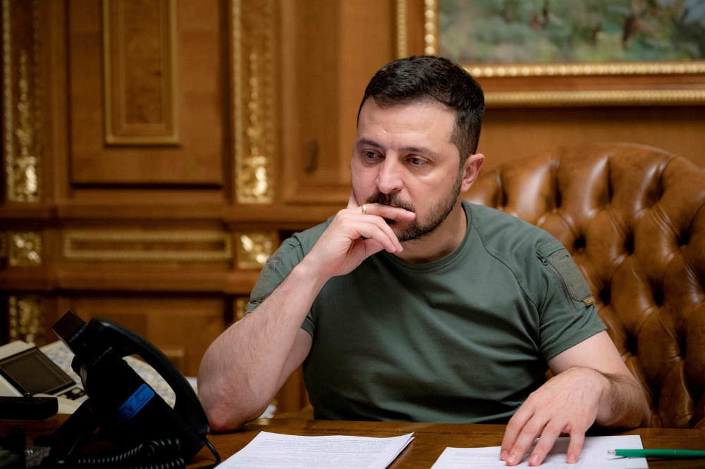 Ukraine's President Volodymyr Zelenskiy is seen during a phone call with U.S. President Joe Biden, amid Russia's attack on Ukraine, in Kyiv, Ukraine October 4, 2022. Ukrainian Presidential Press Service/Handout via REUTERS