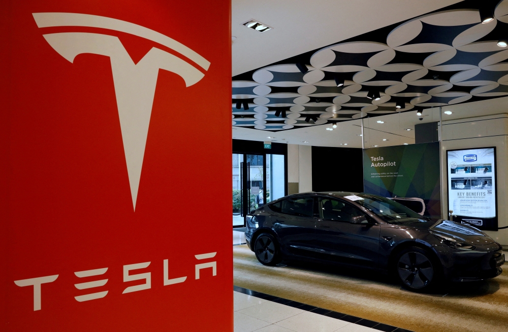 A Tesla model 3 car is seen in their showroom in Singapore on October 22, 2021. Picture taken on October 22, 2021.   File Photo / Reuters

