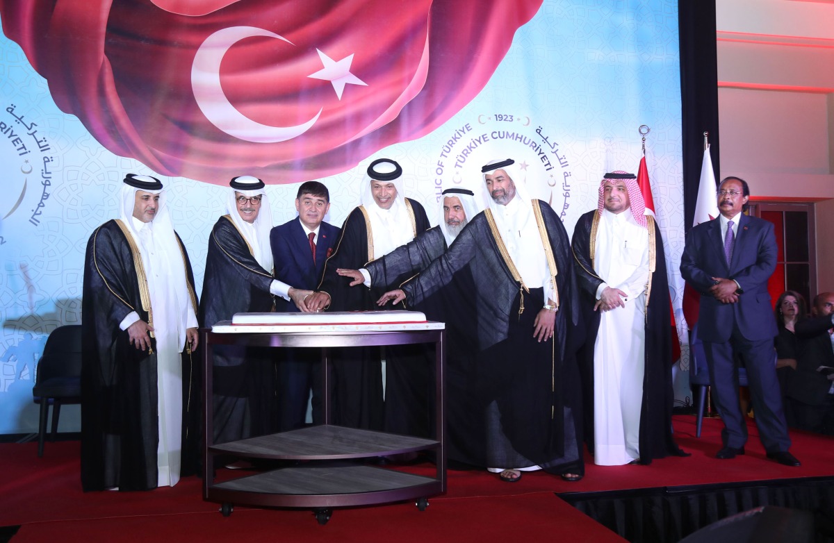 L-R: Minister of Municipality H E Dr. Abdullah bin Abdulaziz bin Turki Al Subaie; Minister of State and President of Qatar National Library H E Dr. Hamad bin Abdul Aziz Al Kawari; Ambassador of Türkiye to Qatar H E Dr. Mustafa Göksu; Speaker of Shura Council H E Hassan bin Abdullah Al Ghanim;  Minister of Awqaf and Islamic Affairs H E Ghanem bin Shaheen bin Ghanem Al Ghanim; Minister of Environment and Climate Change H E Sheikh Dr. Faleh bin Nasser bin Ahmed Al Thani; MoFA Chief of Protocol, H E  Ambassador Ibrahim Yousef Fakhroo and Ambassador of Eritrea, Dean of the Diplomatic Corps, H E Ali Ibrahim, during a cake-cutting ceremony to mark the 99th anniversary of the Republic of Türkiye.