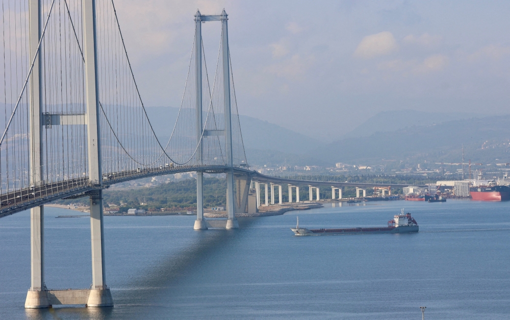 Turkish-flagged cargo ship Polarnet, carrying Ukrainian grain, passes by Osmangazi Bridge entering Gulf of Izmit, Turkey, on August 8, 2022.  File Photo / Reuters