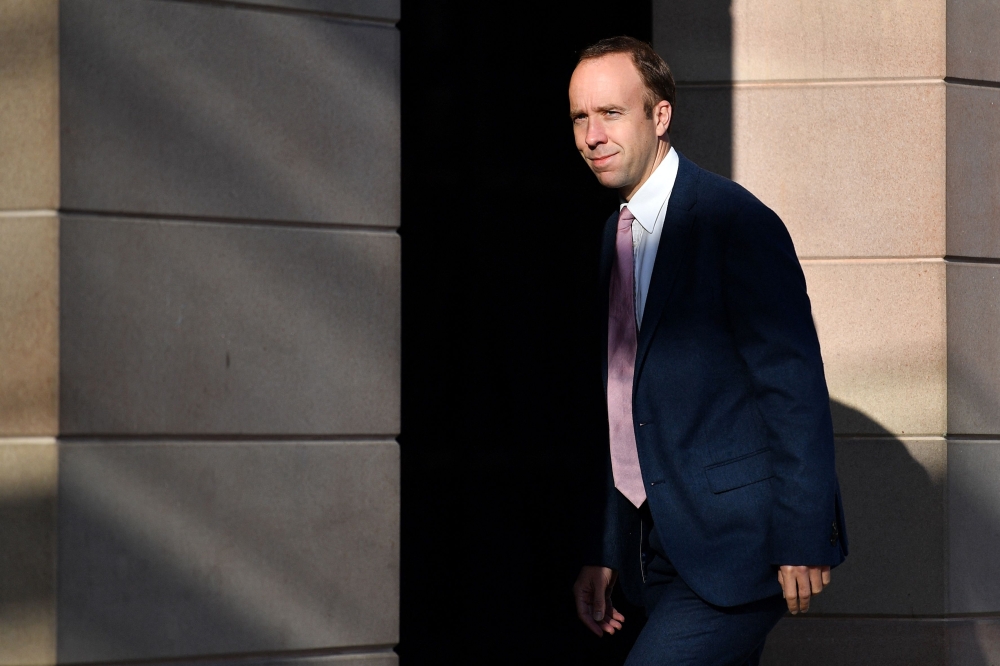 In this file photo taken on November 16, 2021 Conservative MP Matt Hancock arrives to Portcullis House in Westminster, London. - Britain's ruling Conservative party on November 1, 2022, suspended Matt Hancock, the former health minister during the coronavirus pandemic, for appearing on a reality TV show.  (Photo by JUSTIN TALLIS / AFP)