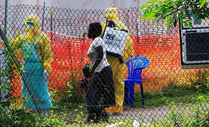 A woman and her child arrive for Ebola related investigation at the health facility at the Bwera General Hospital near the border with the Democratic Republic of Congo in Bwera, Uganda, on June 14, 2019.  File Photo / Reuters