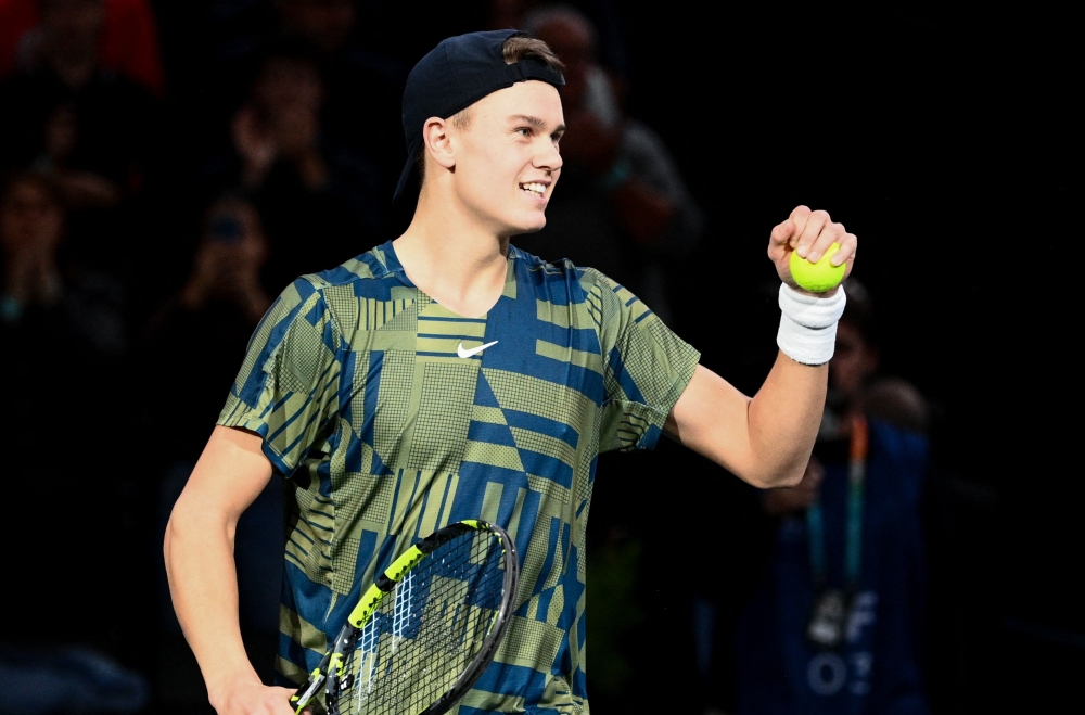 Denmark's Holger Rune celebrates after winning against Canada's Felix Auger-Aliassime at the end of their men's singles semi-final tennis match in Paris on November 5, 2022. Photo by Christophe Archambault / AFP