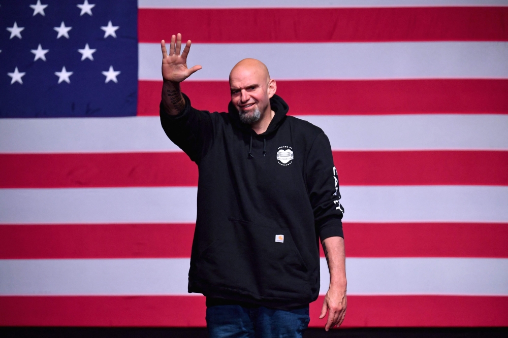 Pennsylvania Democratic Senatorial candidate John Fetterman waves onstage at a watch party during the midterm elections at Stage AE in Pittsburgh, Pennsylvania, on November 8, 2022. Photo by Angela Weiss / AFP