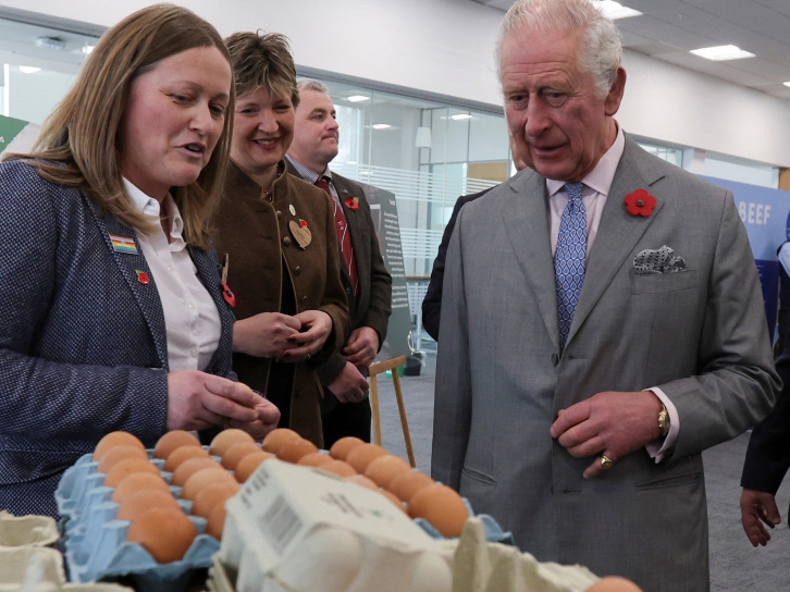 Britain's King Charles looks at eggs as he meets staff and suppliers at Morrisons Supermarkets headquarters during a two-day tour of Yorkshire in Bradford, Britain November 8, 2022. Reuters/Russell Cheyne/Pool