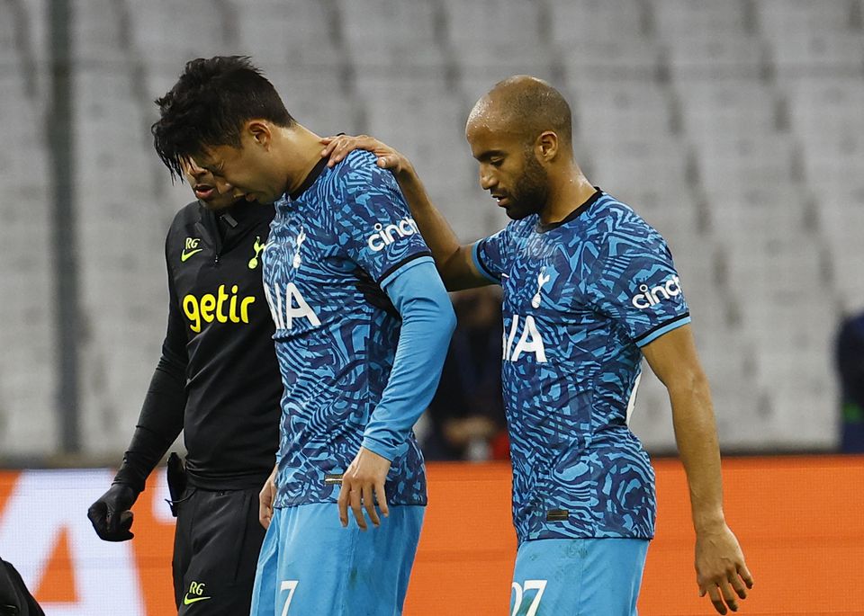 Tottenham Hotspur's Son Heung-min is helped off the pitch by Lucas Moura after sustaining an injury during their Champions League Group D match against Olympique de Marseille at the Orange Velodrome, Marseille, France, on November 1, 2022.  REUTERS/Eric Gaillard
