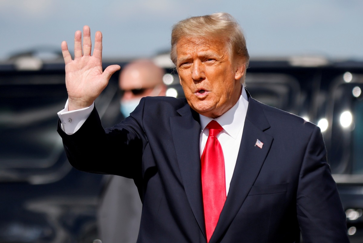 Former US President Donald Trump waves as he arrives at Palm Beach International Airport in West Palm Beach, Florida, US, on January 20, 2021. File Photo / Reuters
