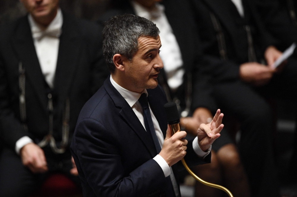 France's Interior Minister Gerald Darmanin (centre) speaks during a session of questions to the government at The National Assembly in Paris on November 15, 2022. (Photo by Christophe ARCHAMBAULT / AFP)