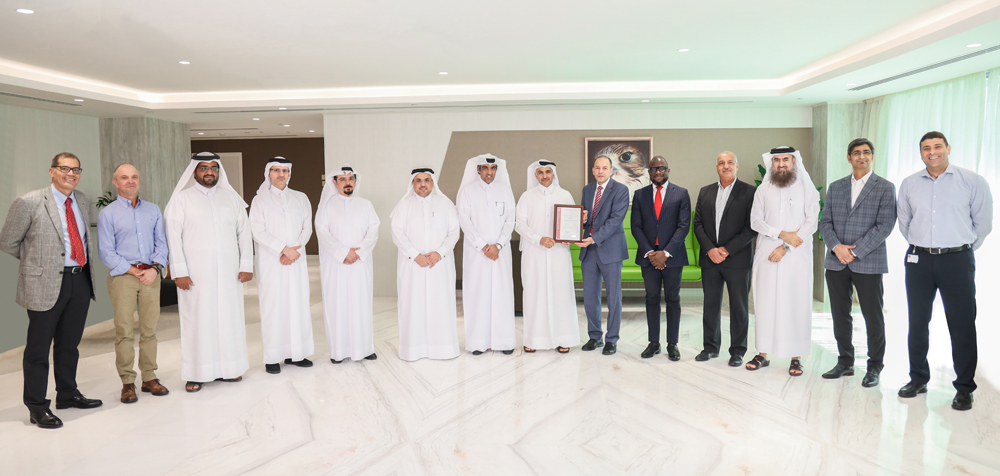  Dolphin Energy officials with the ISO 9001:2015 certificate.