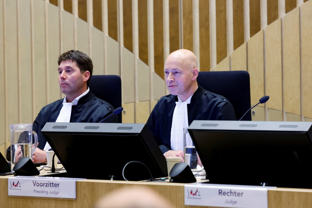 Presiding Judge Hendrik Steenhuis and Judge Dagmar Koster sit in the courtroom as the Dutch court announces its ruling in the MH17 trial of three Russians and a Ukrainian in the Schiphol Judicial Complex, Badhoevedorp, Netherlands, November 17, 2022. (REUTERS/Piroschka van de Wouw)