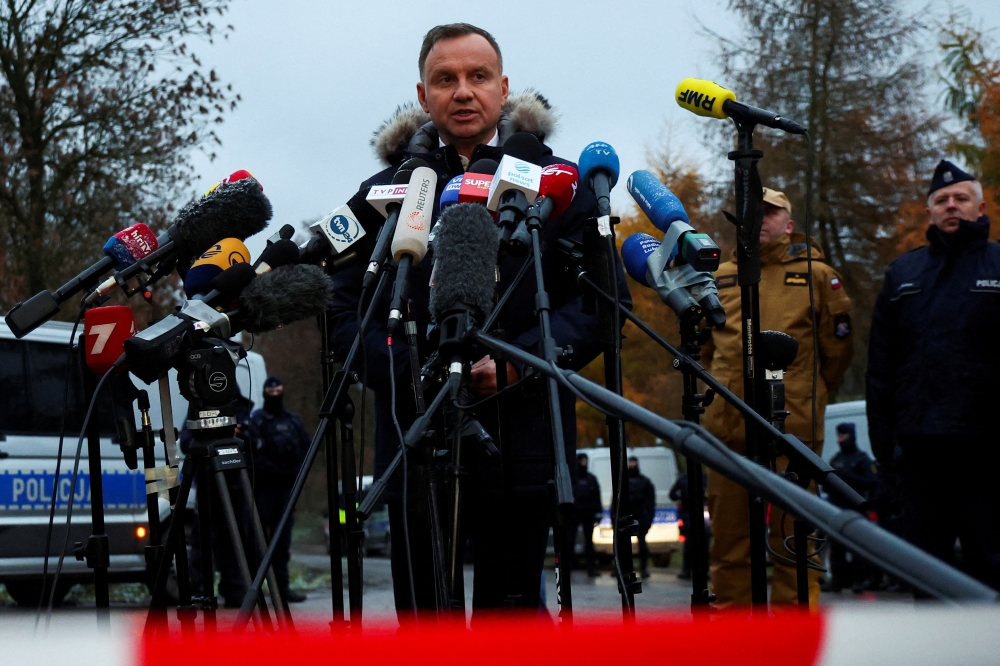 Polish President Andrzej Duda speaks to the media during his visit to the site of an explosion in Przewodow, a village in eastern Poland near the border with Ukraine, November 17, 2022. (REUTERS/Kacper Pempel)