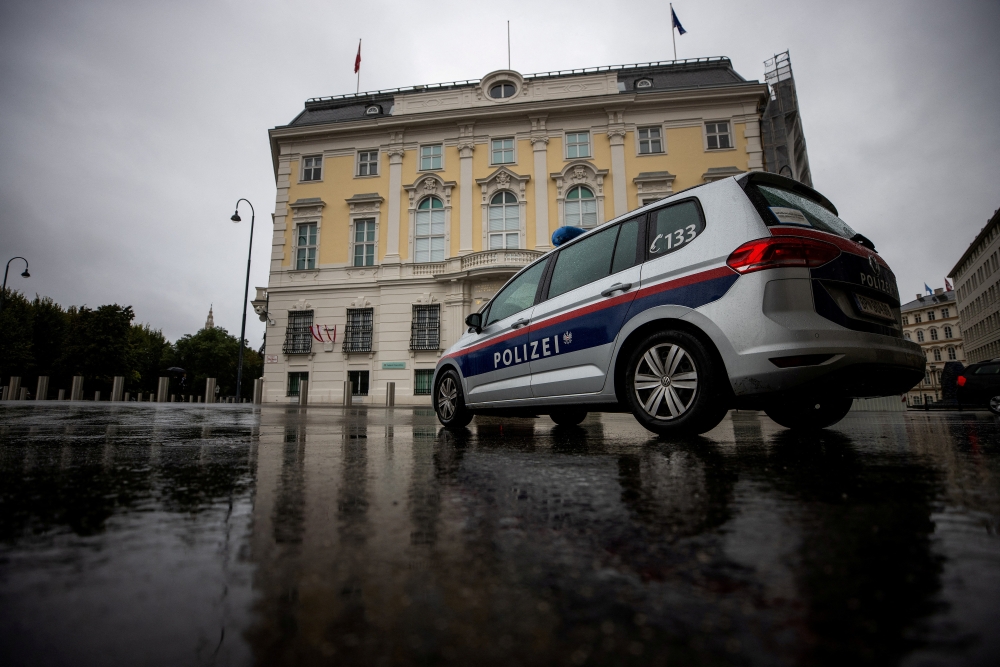 File Photo: A police car parks in front of the Austrian federal chancellery in Vienna, Austria, October 7, 2021. (REUTERS/Lisi Niesner)