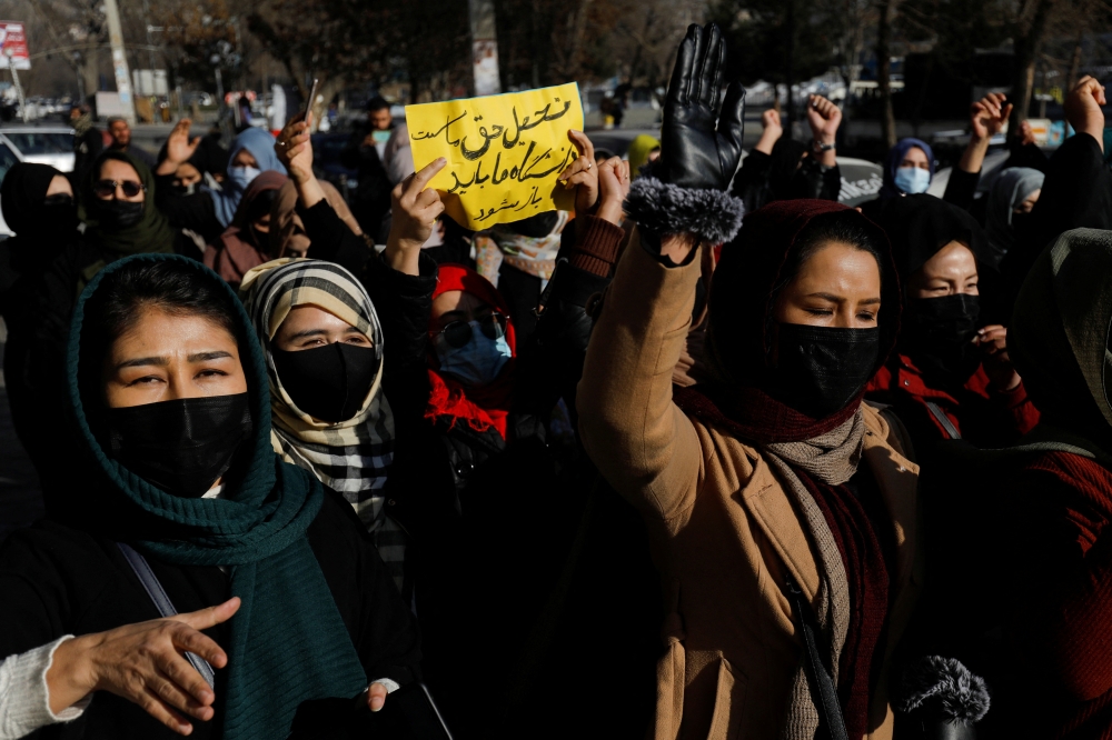 Afghan women chant slogans in protest against the closure of universities to women by the Taliban in Kabul, Afghanistan, December 22, 2022. (REUTERS)