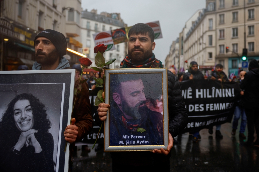 Members of the Kurdish community attend a march organised by the Kurdish Democratic Council in France (CDK-F) in tribute to the victims of Friday's deadly attack, in Paris, France, on December 26, 2022. REUTERS/Sarah Meyssonnier