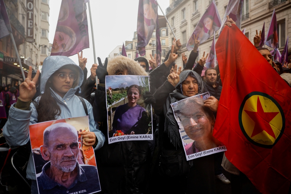Members of the Kurdish community attend a march organised by the Kurdish Democratic Council in France (CDK-F) in tribute to the victims of Friday's deadly attack, in Paris, France, on December 26, 2022. REUTERS/Sarah Meyssonnier