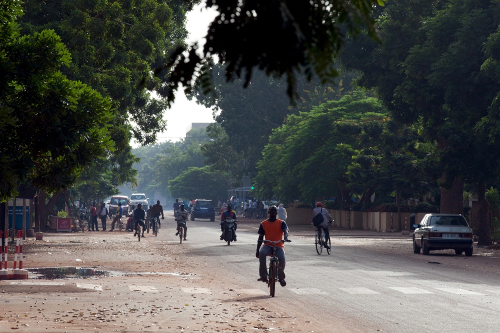 People ride bicycles and motorcycles on a street in Ouagadougou, Burkina Faso, September 17, 2015. File Photo / Reuters
